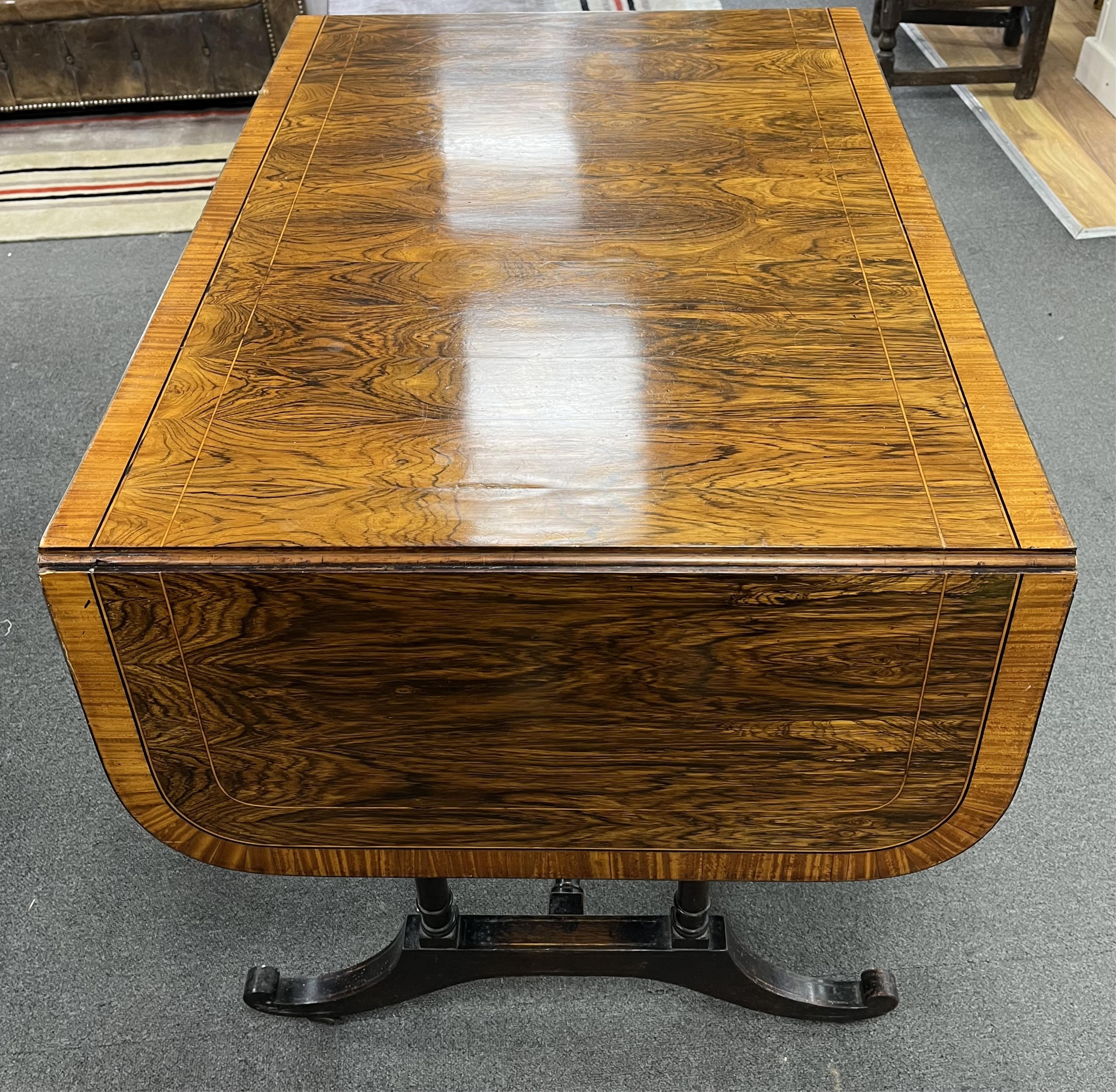 A Regency satinwood banded rosewood sofa table, width 92cm, depth 66cm, height 71cm. Condition - fair